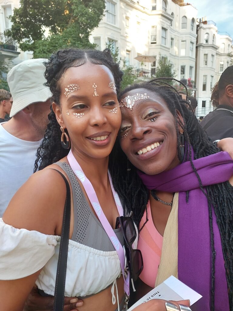 Carnival blossoms in every embrace — strangers turned kin, laughter woven with glitter and grace. The spirit of togetherness is the true heartbeat of the streets.