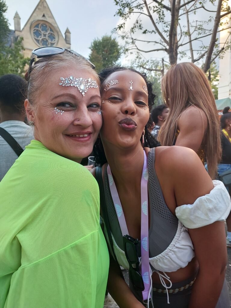 Carnival blossoms in every embrace — strangers turned kin, laughter woven with glitter and grace. The spirit of togetherness is the true heartbeat of the streets.