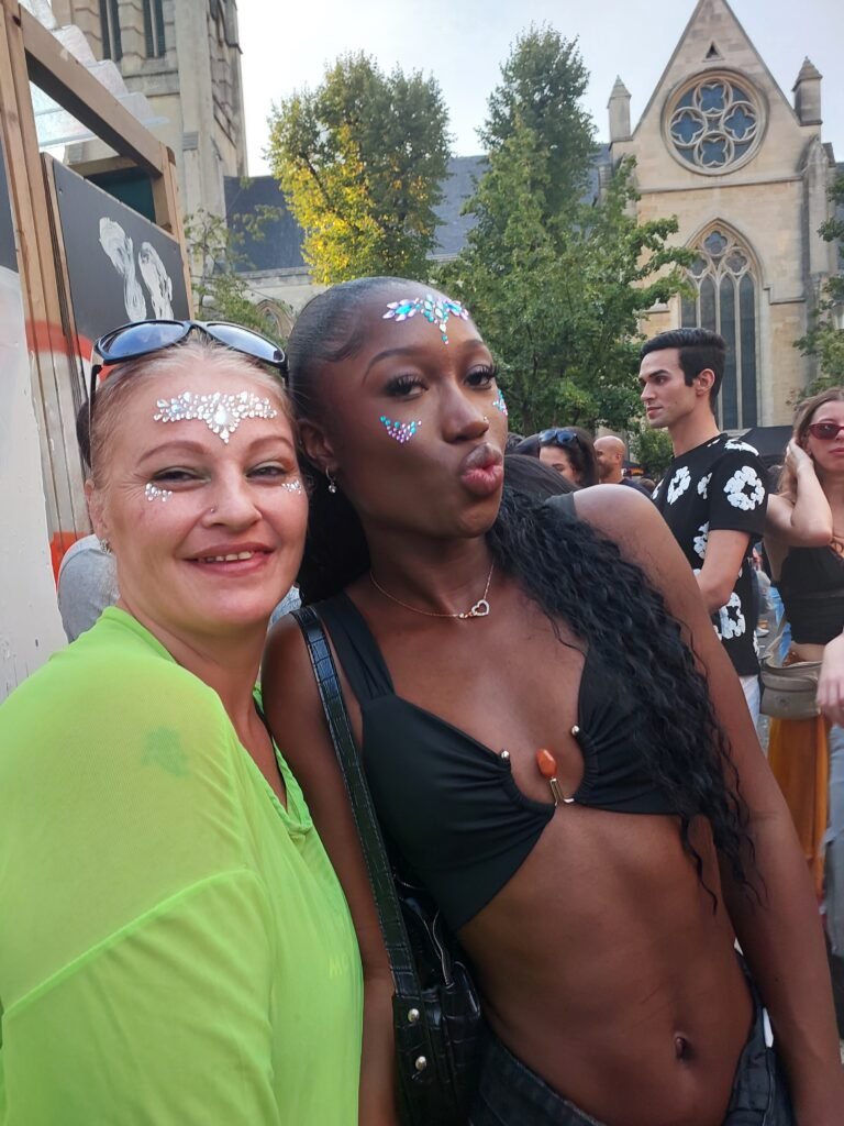 Generations of joy — glitter and light weaving new kinship under Carnival skies.